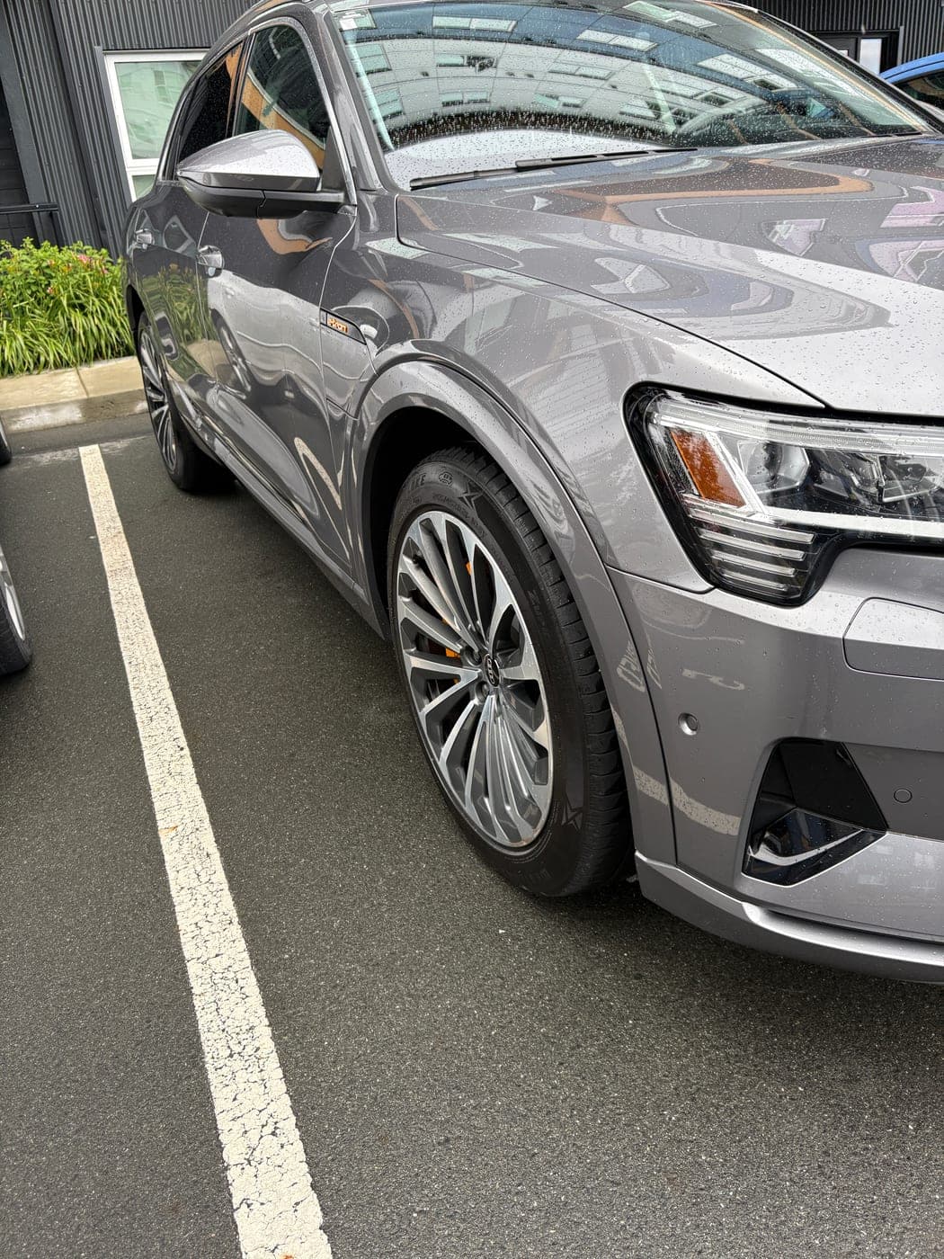 Grey Audi e-tron with polished wheels and glossy paintwork